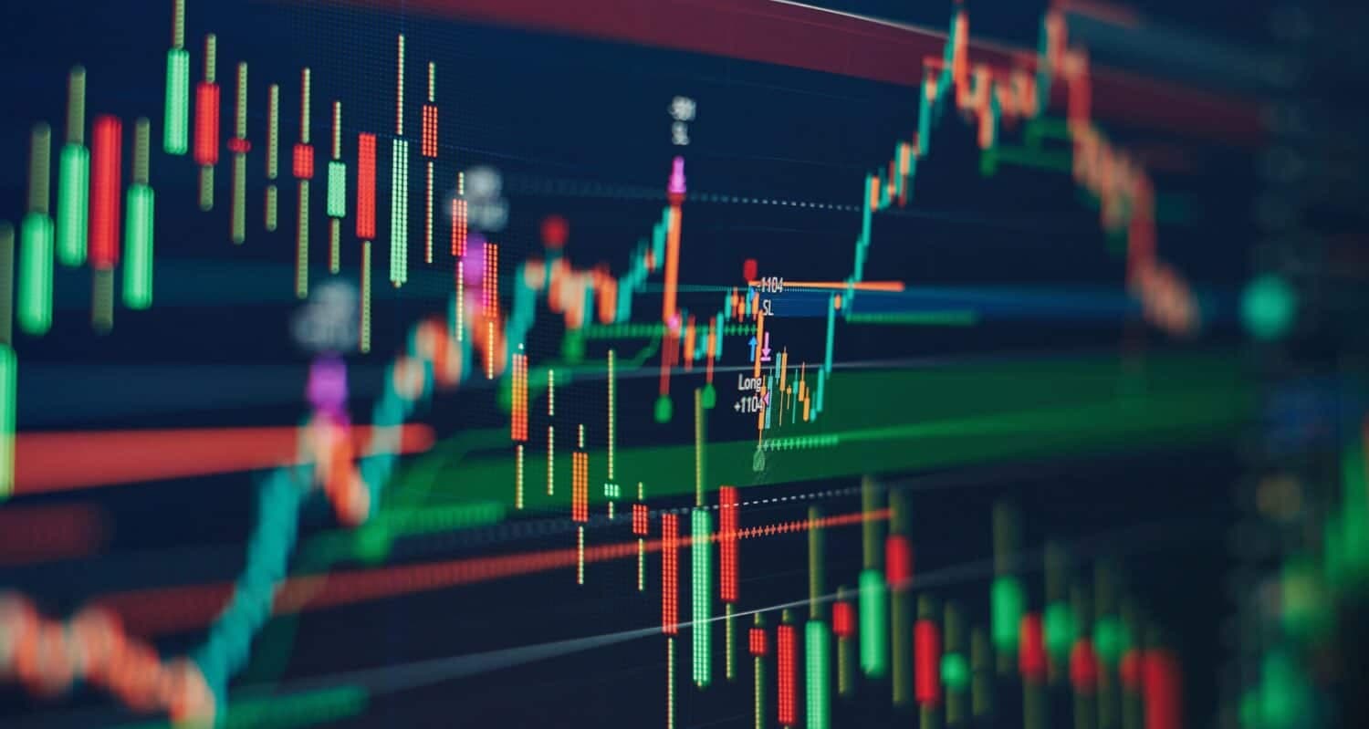 Technical price graph and indicator, red and green candlestick chart on blue theme screen, market volatility, up and down trend. Stock trading, crypto currency background.
